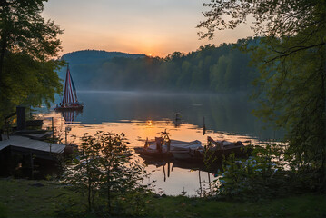 Beautiful lakeside and dock wooden boats at early morning sunrise