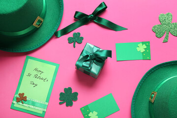 Festive card with leprechaun hats, gift box and decor on pink background. St. Patrick's Day...