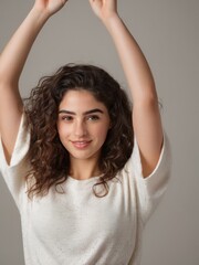 Fototapeta premium attractive young beautiful girl posing with both hands up