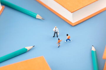 A microphotography teacher teaches a class in a book