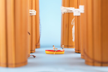 Miniature creative boating in bamboo slips between ancient books