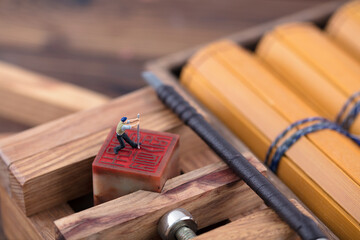 Miniature photo carving figures at work