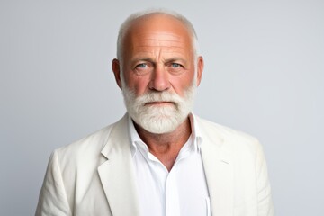 Portrait of senior man with white beard. Isolated on grey background.