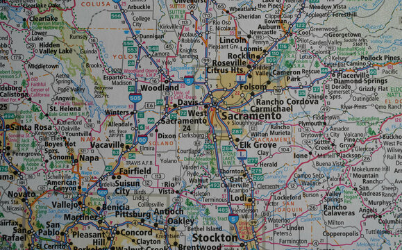 Close-up view of a map of the Sacramento, California area on a road atlas.