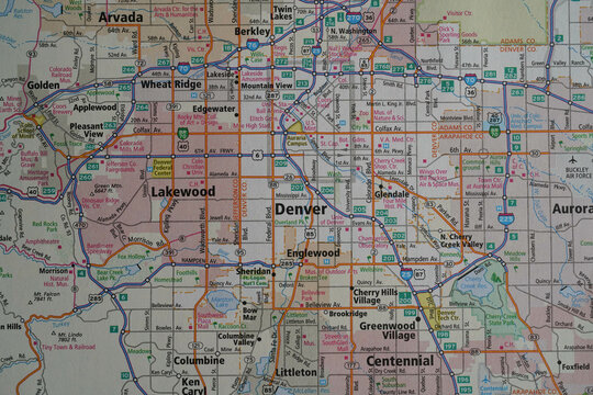 Close-up view of a map of the Denver, Colorado area in a road atlas. 
