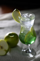 refreshing drink with green apple fruits and syrup preparing an alcoholic drink