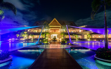 Fototapeta na wymiar Resort pools at night with clouds and stars