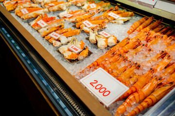 Fresh seafood selling at Kuromon Ichiba in Osaka Japan. The Kuromon Ichiba is a spacious market with vendors selling street food, fresh produce and shellfish, plus souvenirs, Seafood in Kuromon Market