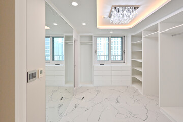 The dressing room that women dream of is decorated with built-in furniture