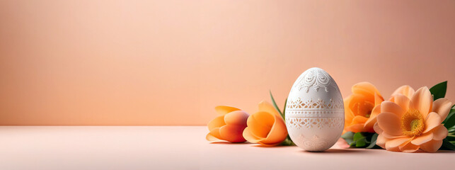 A peach-colored billboard with delicate flowers and an openwork egg, as a symbol of Easter. Free space for text - obrazy, fototapety, plakaty