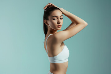 Close-up view of young woman wearing white fitness clothes