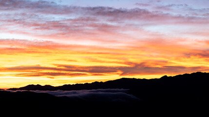 Top view Landscape of Morning Mist with Mountain Layer at north of Thailand. mountain ridge and clouds in rural jungle bush forest
