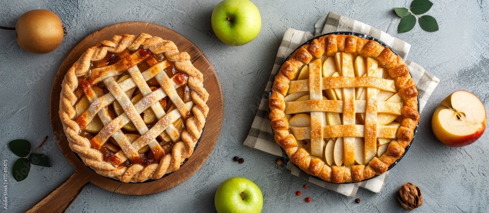 Poster apple and pear pie on a concrete background; rustic-style apple pie on a wooden board; composition w