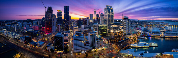 Panoramic view of Auckland city skyline and waterfront at dusk