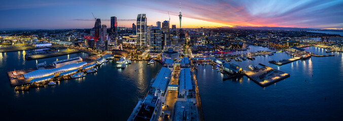 Panoramic view of Auckland city skyline and waterfront at dusk