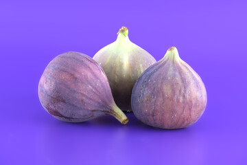 Group of figs over purple background