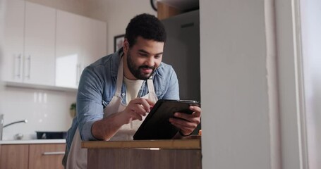 Happy man, tablet and research in kitchen for cooking recipe, ingredients or online tutorial at home. Male person or chef with technology for virtual class, course or reading ingredients at house