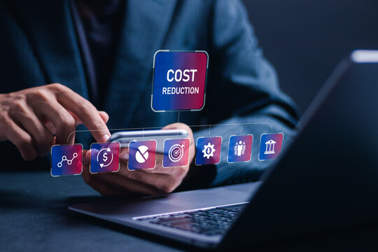 Cost reduction business finance concept. Businessman use laptop with virtual screen of cost reduction icon for budget management and cost management.