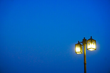 Light at lamp post with twilight sky background