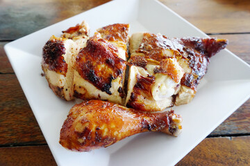 Grilled chicken in white dish, Close up shot