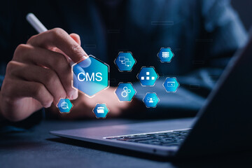 CMS, Content management system concept, Businessman use laptop with virtual screen of content management system icon for business website management.