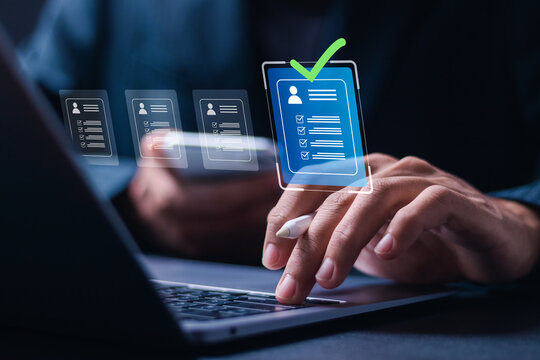 HR, Human resource management concept, Businessman use use laptop to Resume checklist for employee recruitment. Screening employee information and job applicants.