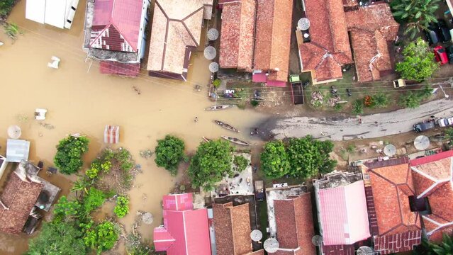 Aerial footage of villages and residents houses being submerged by overflowing rivers which resulted in flooding in Musi Rawas Utara, South Sumatra, Indonesia 4K Drone Video | Banjir Musi Rawas Utara