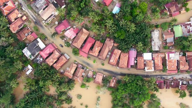 Aerial footage of villages and residents houses being submerged by overflowing rivers which resulted in flooding in Musi Rawas Utara, South Sumatra, Indonesia 4K Drone Video | Banjir Musi Rawas Utara