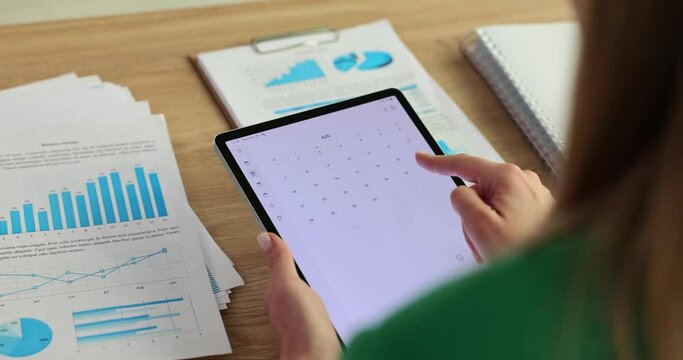 Tablet with a calendar app on screen and filled with various weekly appointments