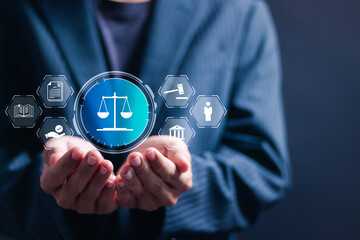 Legal advice business concept. Businessman holding virtual law icon for business legal advice, Labor law, Lawyer, Attorney at law.