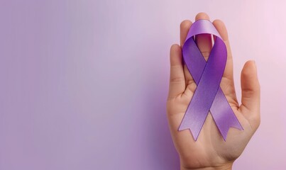 health and treatment concept - womand hand holding purple cancer awareness ribbon. - obrazy, fototapety, plakaty