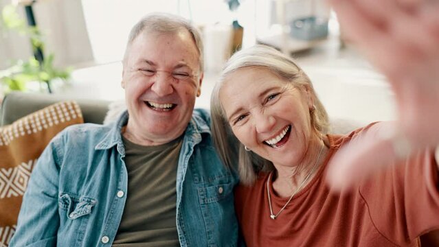 Smile, selfie and senior couple on a sofa with positive, good and confident attitude at home. Happy, love and elderly man and woman in retirement with photography picture in living room of house.