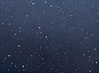 Fototapeta premium Snow is falling on a blue background