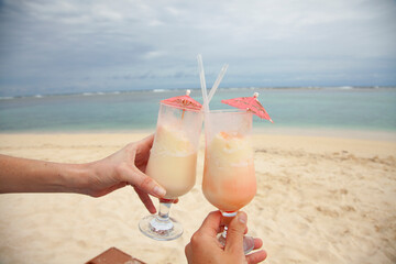 Belize island South Water Caye. Fruity cocktail on the beach