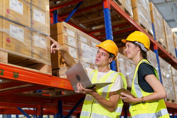 The male and female warehouse officers are currently working together to conduct a thorough stock inventory within the warehouse