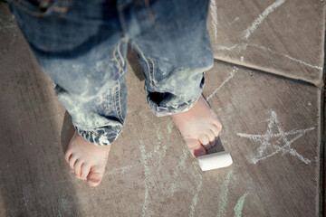 Child playing with chalk