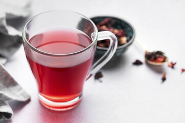 Glass cup of hot hibiscus tea.