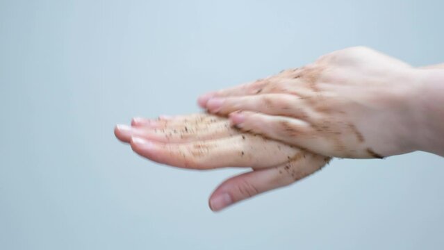 Coffee scrub on female hand, concept of natural cosmetics.