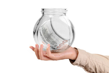 A businessman shows a glass jar filled with dollar cash bills