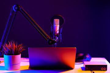 Professional microphone and laptop in recording studio