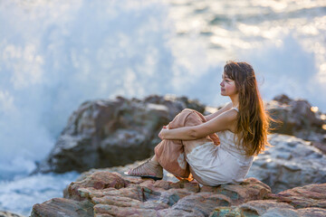 Travel, beach and Asian woman relax on island on sand for adventure, holiday and vacation. Tropical ocean and female person in Tie-dye dress by sea for tourism, traveling and summer getaway