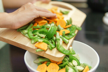 Colorful view of pieces of vegetables on a cutting board