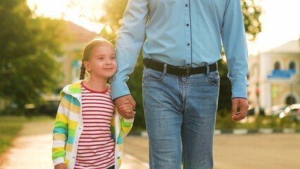 father with little child park, happy family, dad holding little child hand, parental care kid,...