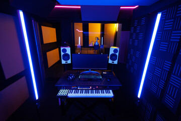 Remote control of a professional sound engineer. A piano with speakers and a monitor