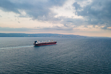 Aerial view of Large Bulk carrier ship transport unpackaged bulk cargo underway through Dardanelles...