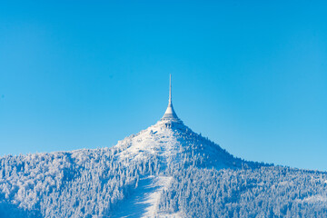 Jested Mountain with unique hotel and TV transmitter on the top on sunny winter day, Liberec, Czechia - obrazy, fototapety, plakaty