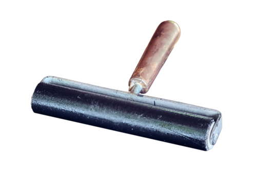 Roller for even distribution of ink on the old printing press, isolated on a white background. Vintage typographic print blotter. Printing of books in the middle ages, historical reconstruction