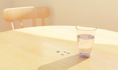 木目テーブルの上の水の入ったコップとお薬