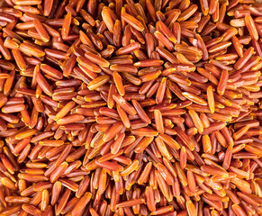 Raw brown rice as background and texture. Selective focus