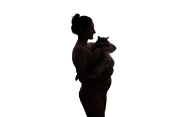 Silhouette of a woman during pregnancy with a cat in her hands, isolated on a white background. Concept of problems with a pet due to toxoplasmosis